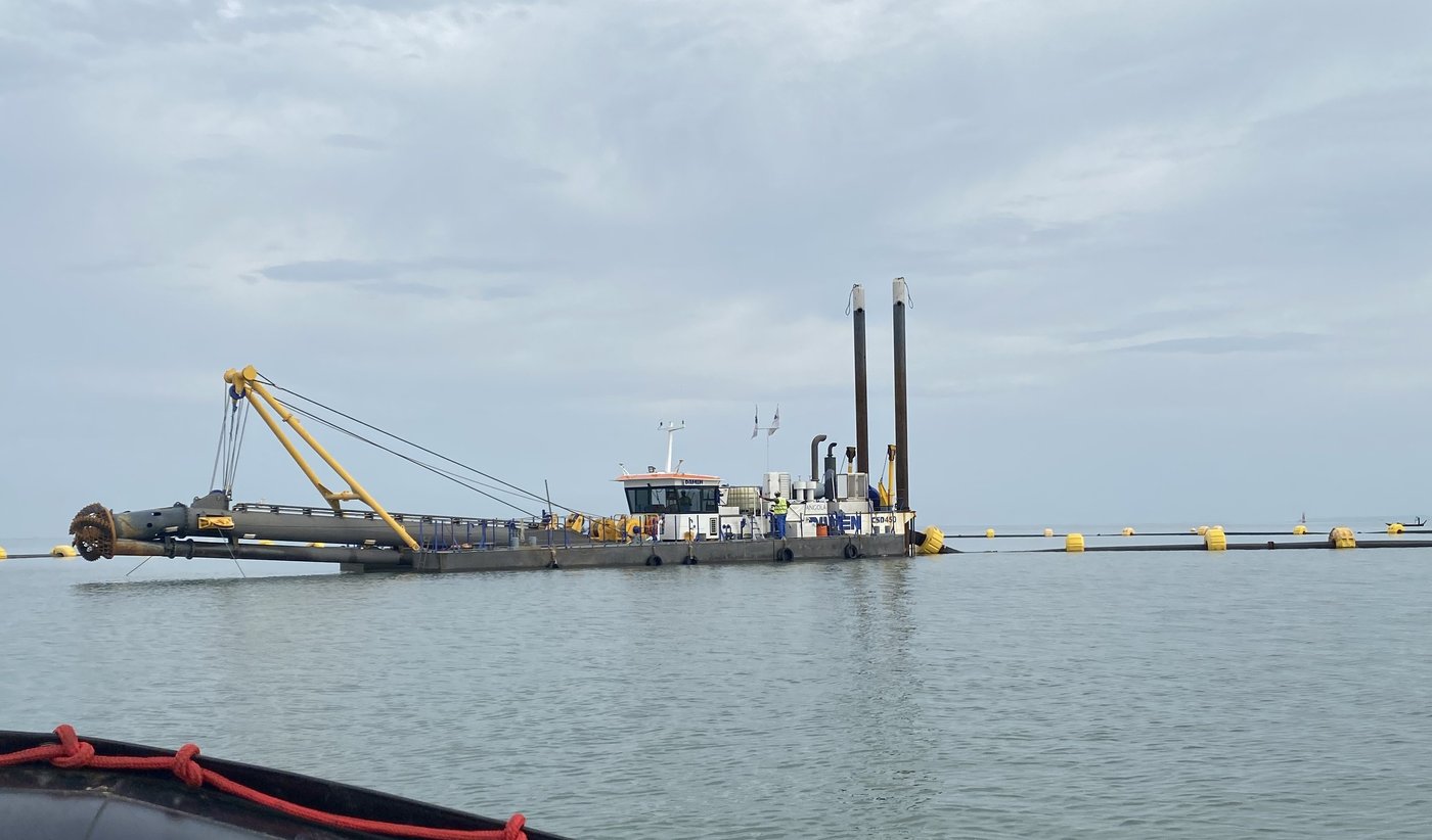 Dredger and barge during the bathymetric monitoring work in Angola